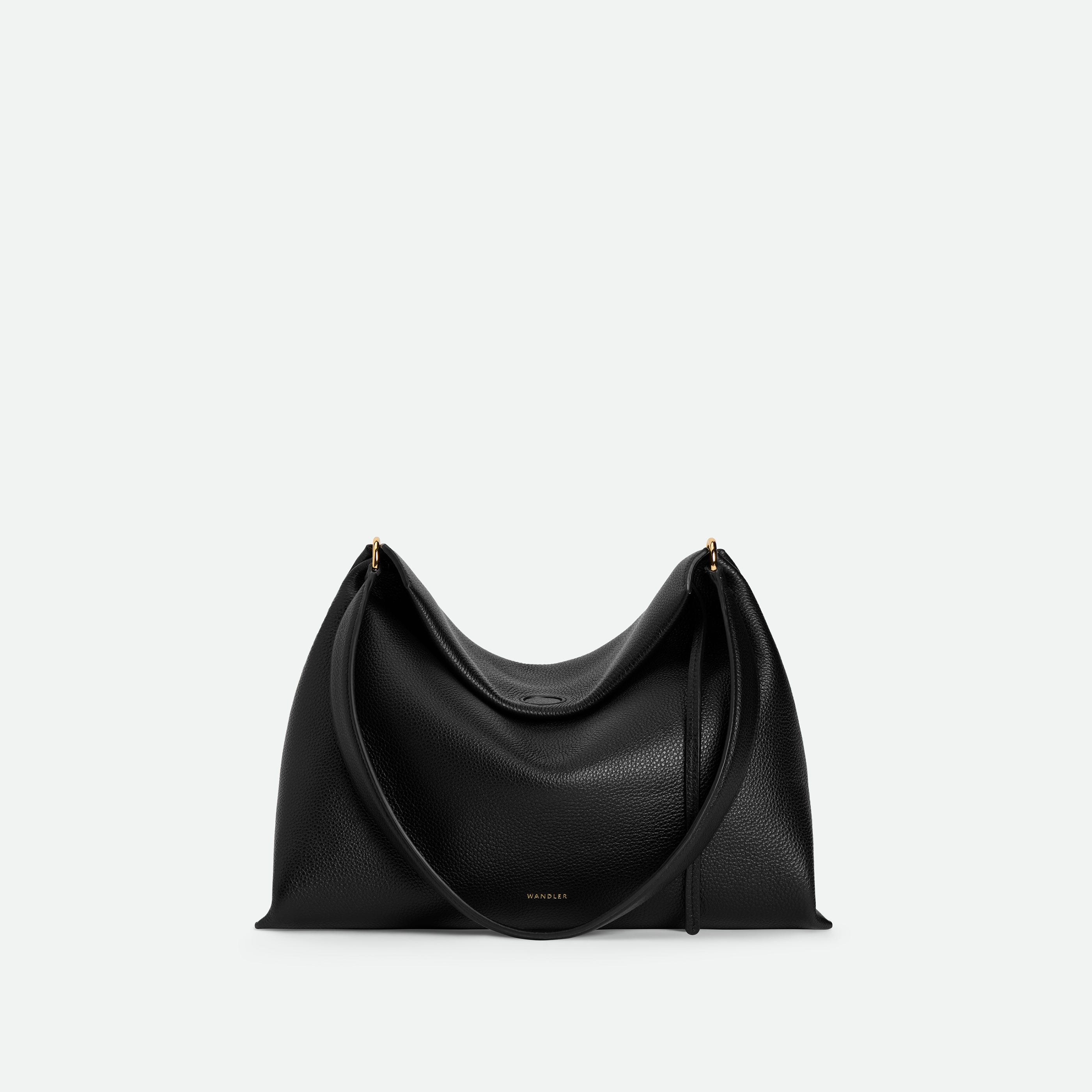 Wandler Penelope Tote Small in the color Black Crust made from calf leather with golden hardware and soft slouchy silhouette, front view.
