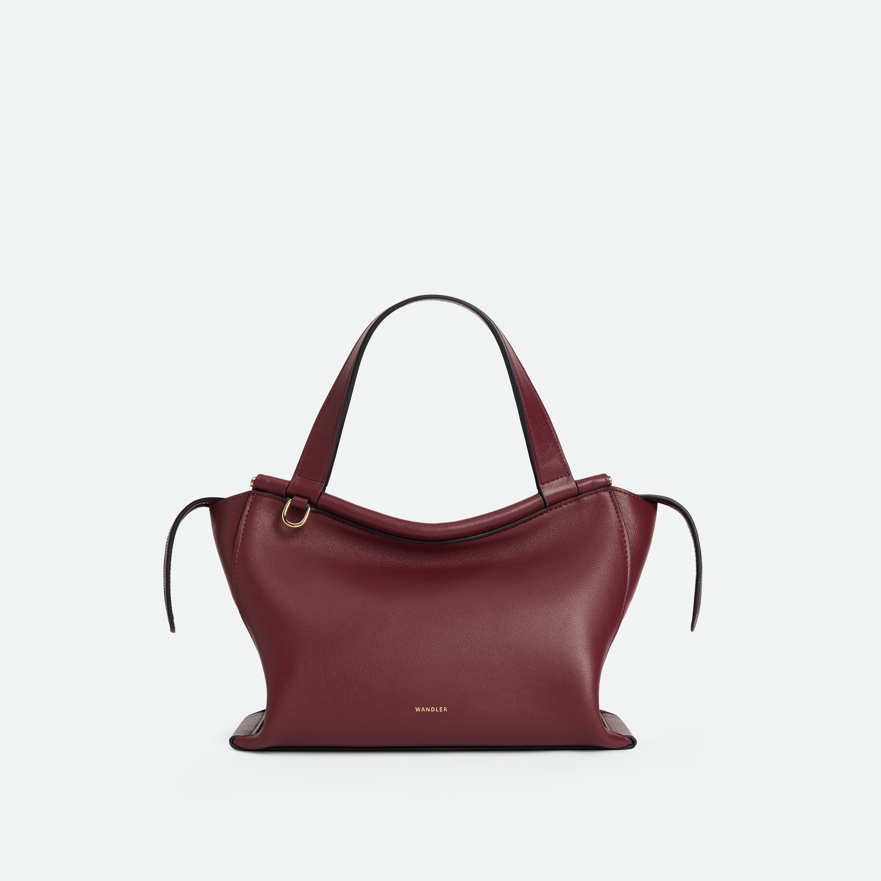 Wandler Ida Bag in BORDEAUX Italian calf leather with golden hardware and sculptural top handle, front view.