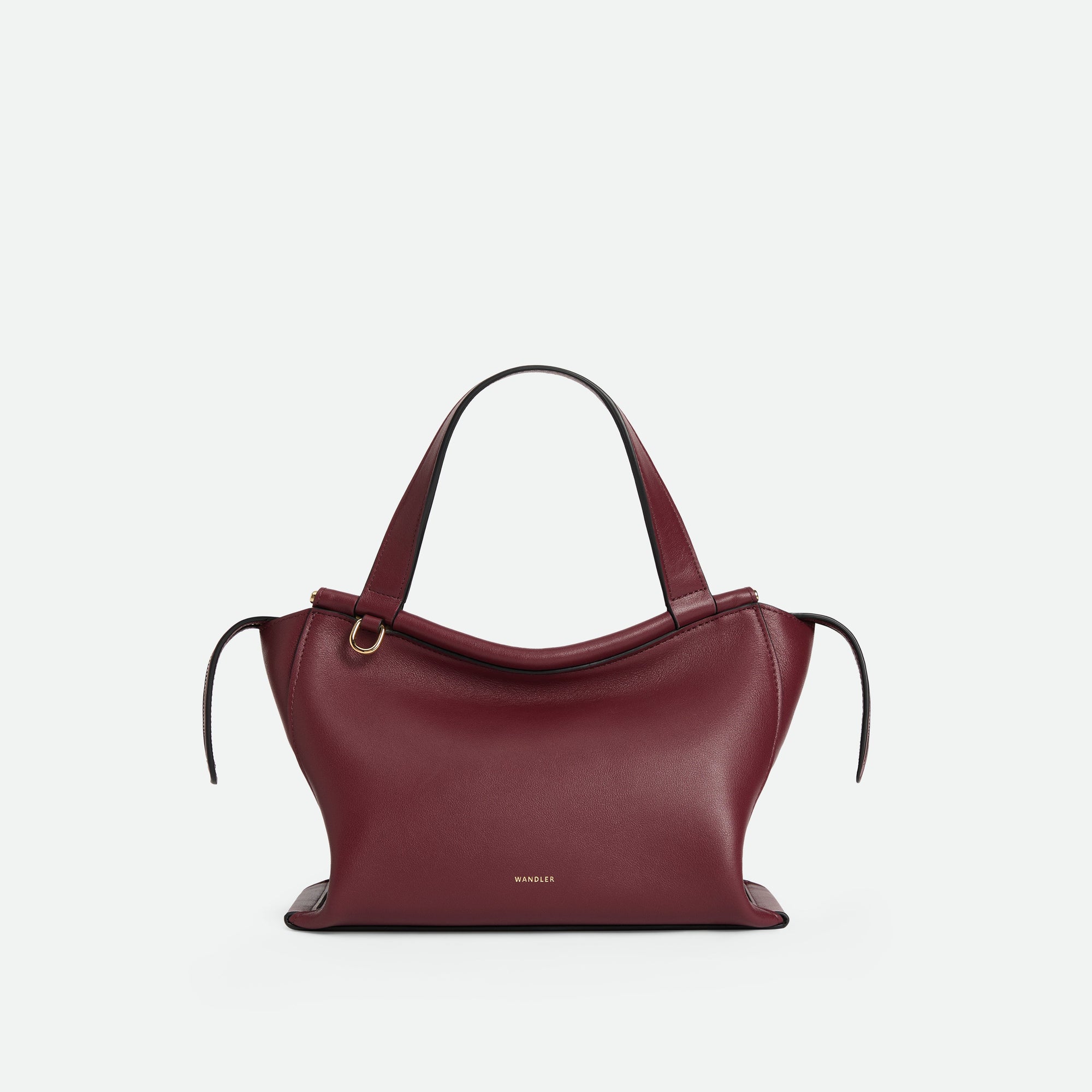 Wandler Ida Bag in BORDEAUX Italian calf leather with golden hardware and sculptural top handle, front view.