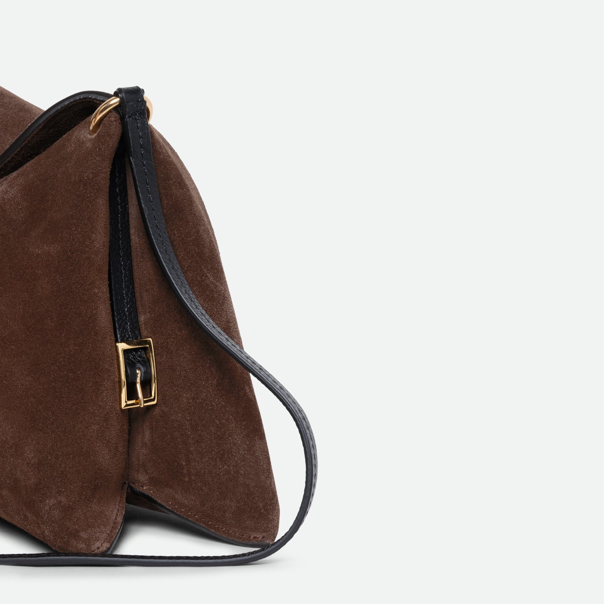 Wandler Penelope Slouch Bag in the color Palissander Suede, made from calf leather with golden hardware and adjustable slim strap, close up detailing side of the bag.